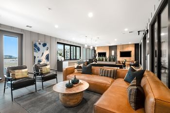 Sports lounge with tvs, kitchen & accordion window for indoor/outdoor experience